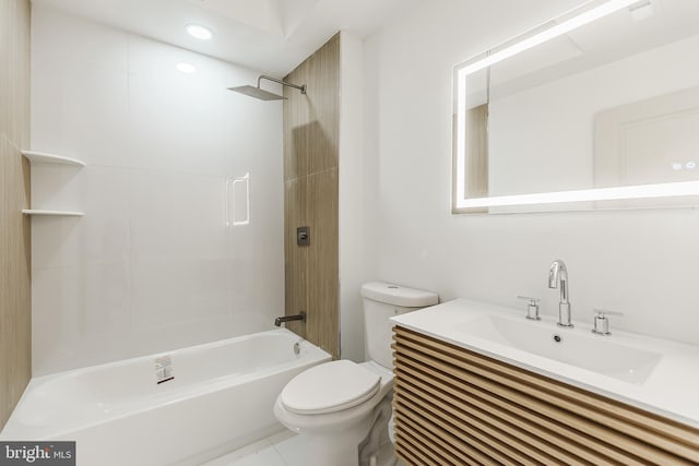 full bathroom with vanity, tiled shower / bath combo, and toilet