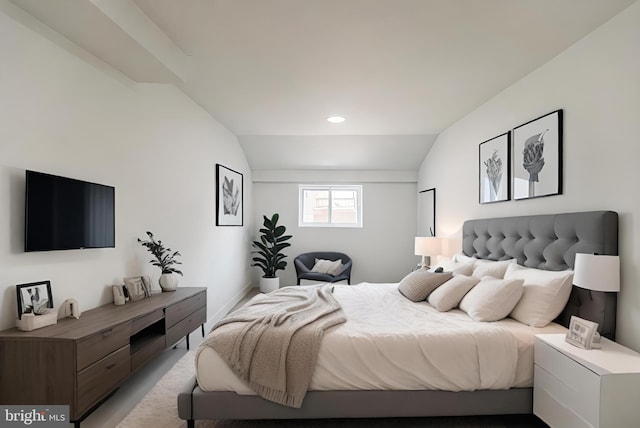 bedroom with lofted ceiling