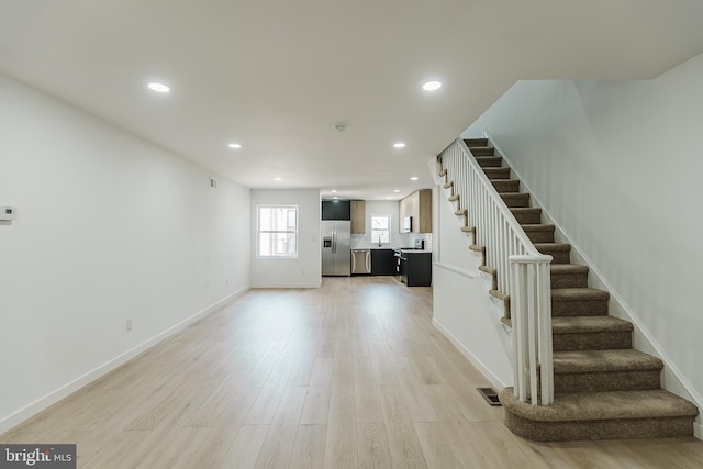 unfurnished living room with light hardwood / wood-style floors