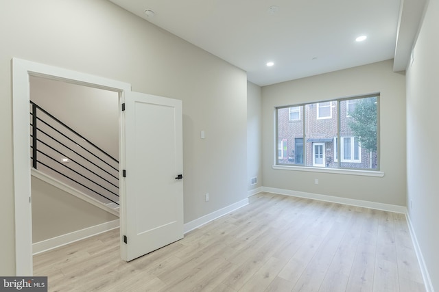 empty room with light wood-type flooring