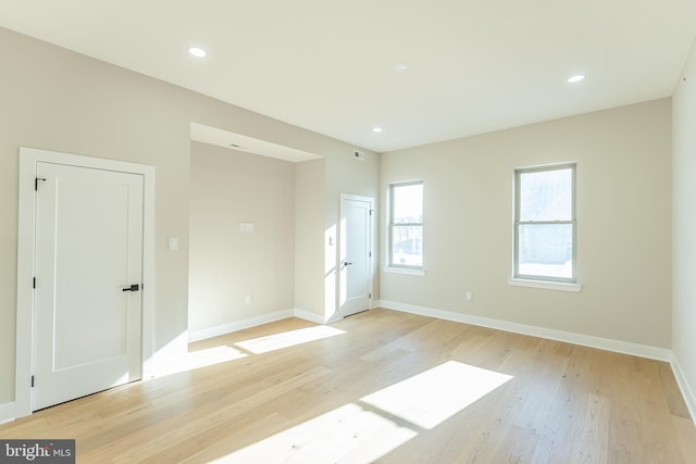 spare room featuring light hardwood / wood-style flooring