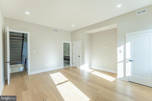 spare room with light wood-type flooring