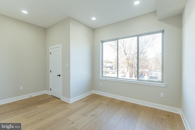 unfurnished room with light hardwood / wood-style floors