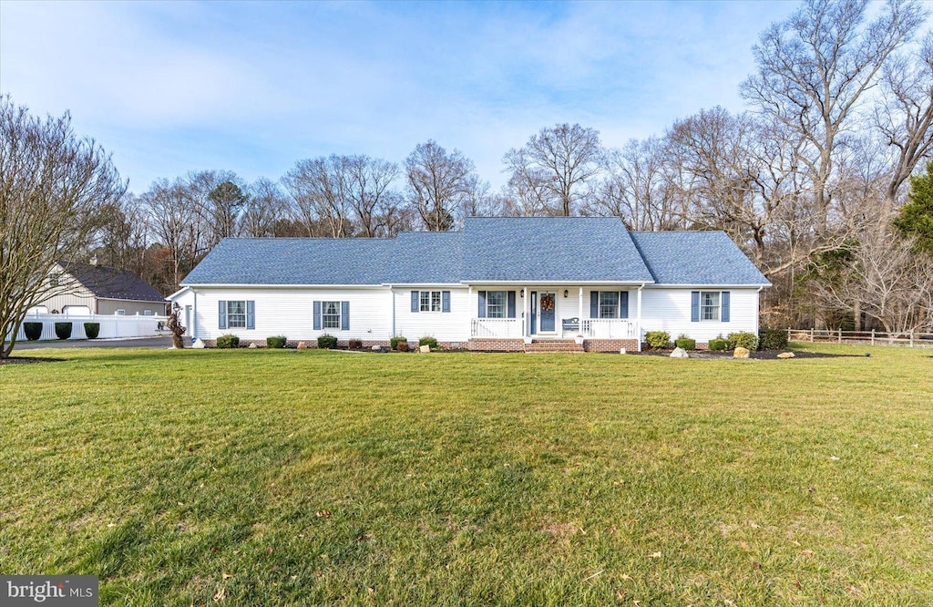 view of front of house with a front lawn and covered porch