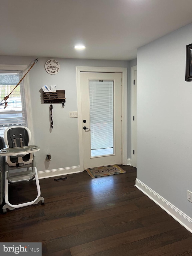 doorway featuring dark hardwood / wood-style flooring