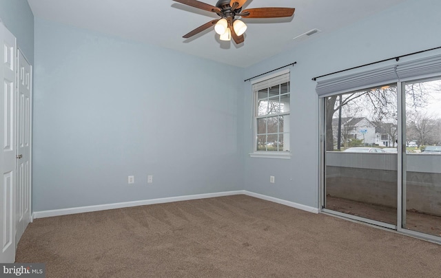 carpeted empty room with ceiling fan