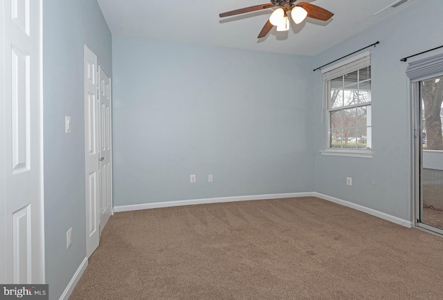 empty room with light colored carpet and ceiling fan