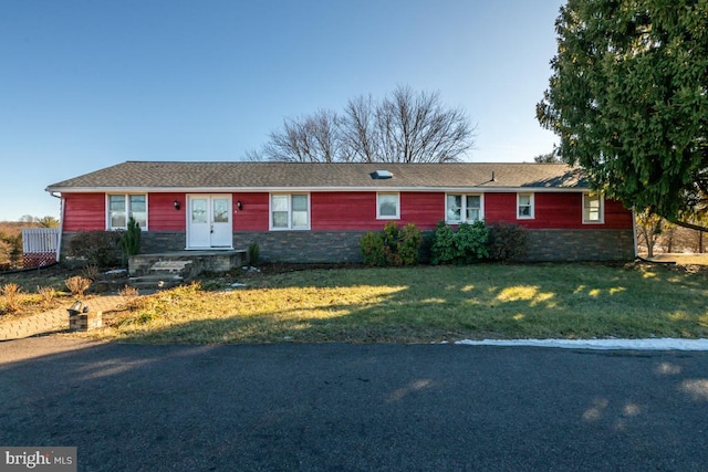 ranch-style home with a front yard