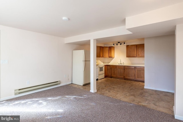 kitchen featuring white appliances, a baseboard radiator, light carpet, and rail lighting