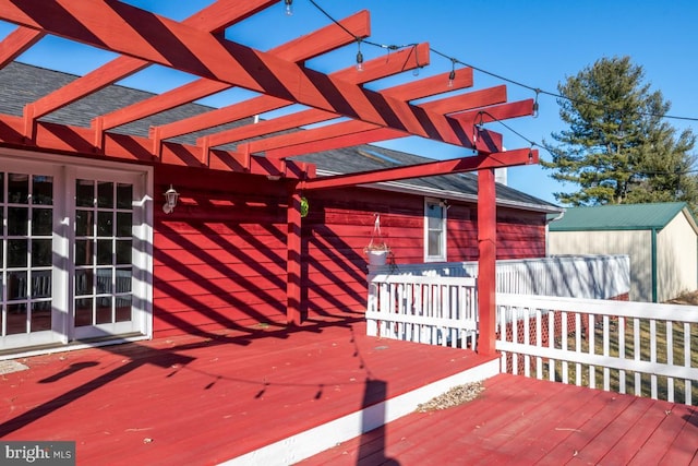 deck with a pergola and french doors