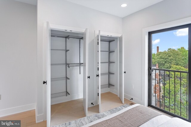 bedroom with a closet and multiple windows