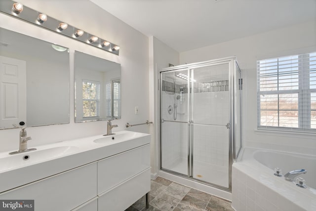 bathroom featuring independent shower and bath and vanity