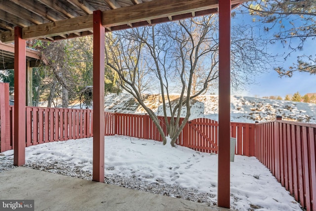 view of yard layered in snow