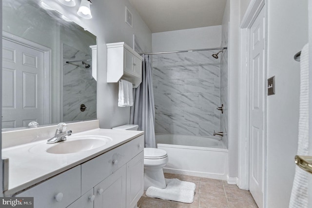 full bathroom featuring toilet, vanity, shower / tub combo, and tile patterned flooring