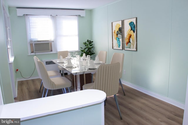 dining area featuring hardwood / wood-style floors and cooling unit