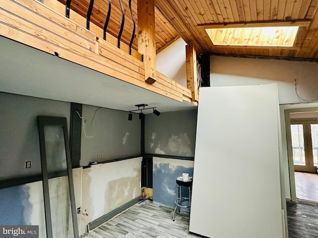 basement with wooden ceiling and light wood-type flooring