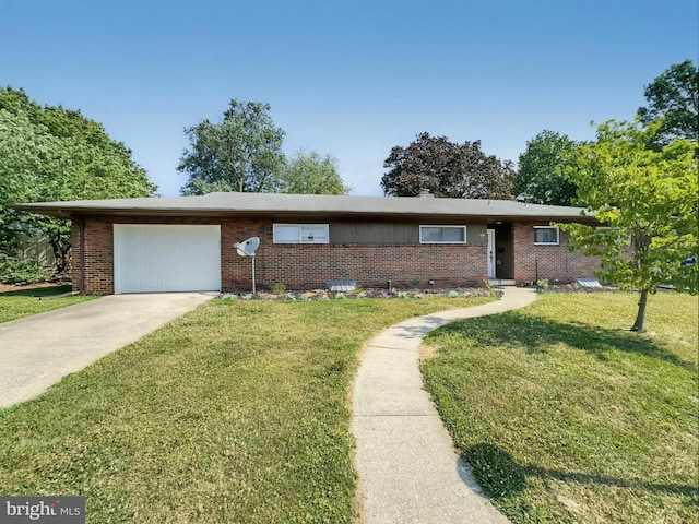 single story home with a garage and a front lawn