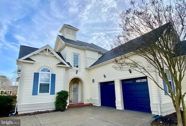 view of front of property with a garage