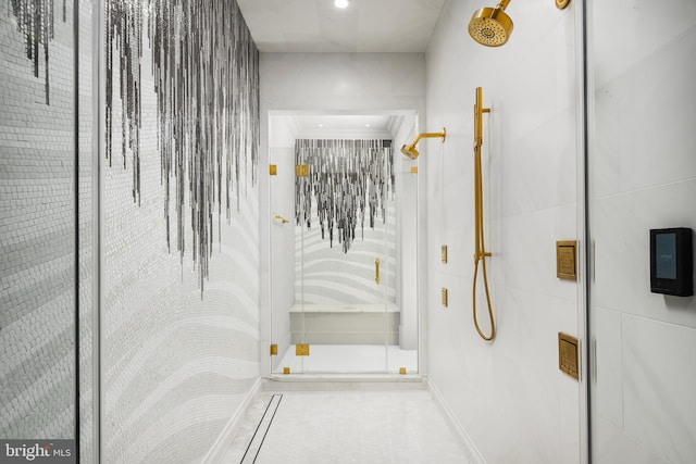 bathroom featuring a shower with door