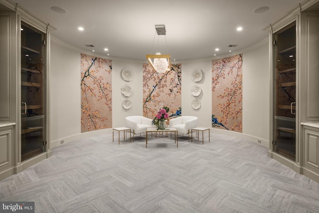 unfurnished room featuring light parquet floors and crown molding