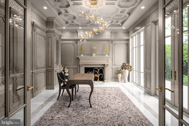 interior space featuring a healthy amount of sunlight, coffered ceiling, and a notable chandelier