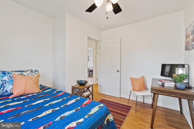 bedroom featuring ceiling fan and hardwood / wood-style floors