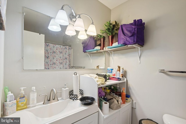 bathroom with vanity and toilet