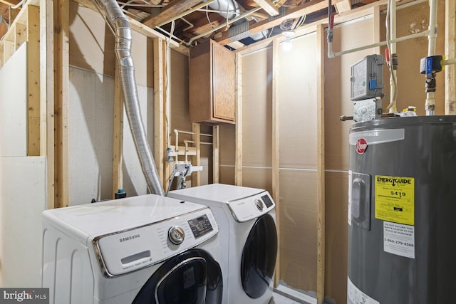 laundry area with washer and dryer and electric water heater