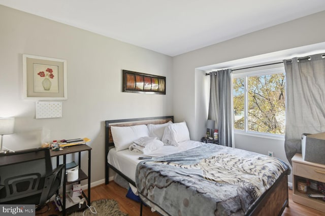 bedroom featuring wood-type flooring