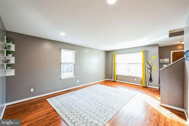 unfurnished room featuring a healthy amount of sunlight and light wood-type flooring