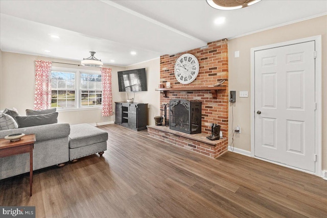 living room with wood-type flooring and a fireplace