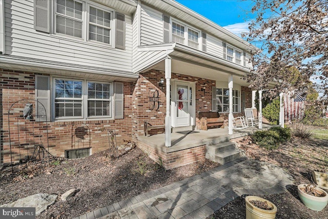 entrance to property with a porch