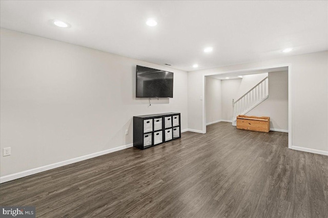 basement featuring dark hardwood / wood-style floors