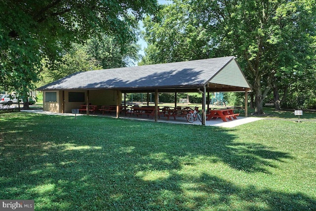 view of home's community with a lawn