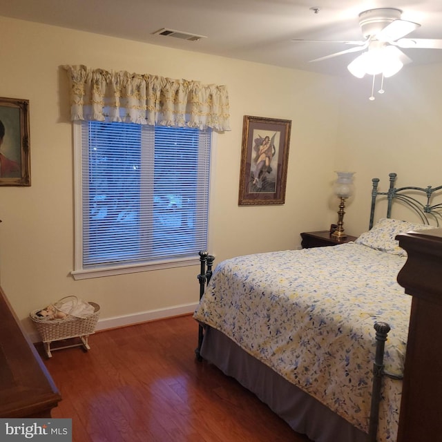 bedroom featuring dark hardwood / wood-style floors and ceiling fan