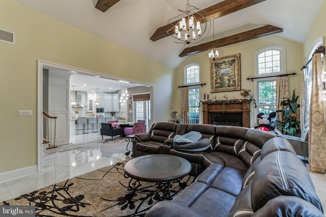 living room featuring beam ceiling, high vaulted ceiling, a notable chandelier, and a healthy amount of sunlight