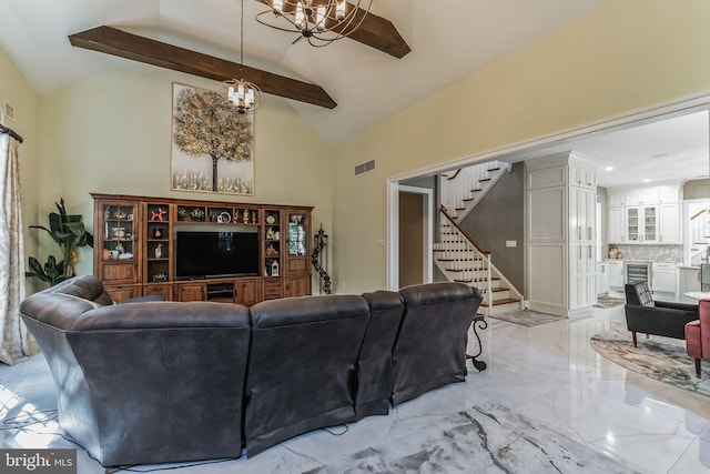 living room featuring beamed ceiling, high vaulted ceiling, an inviting chandelier, and beverage cooler