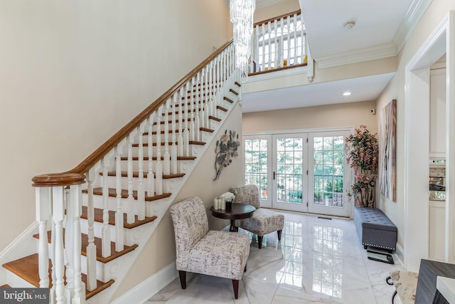 stairs with french doors and ornamental molding