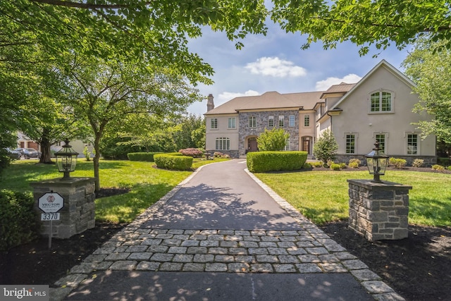 view of front of home with a front lawn