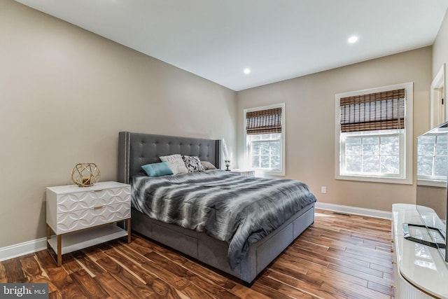 bedroom featuring dark hardwood / wood-style floors