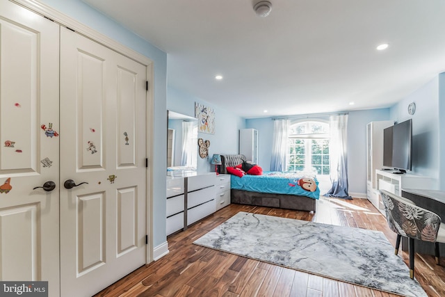 bedroom featuring dark wood-type flooring