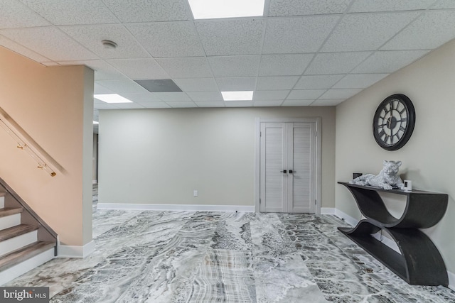 foyer entrance with a paneled ceiling