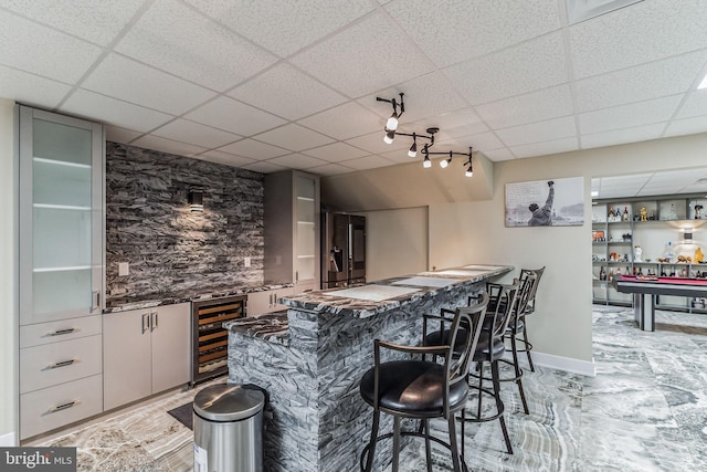 bar featuring wine cooler, a drop ceiling, and billiards