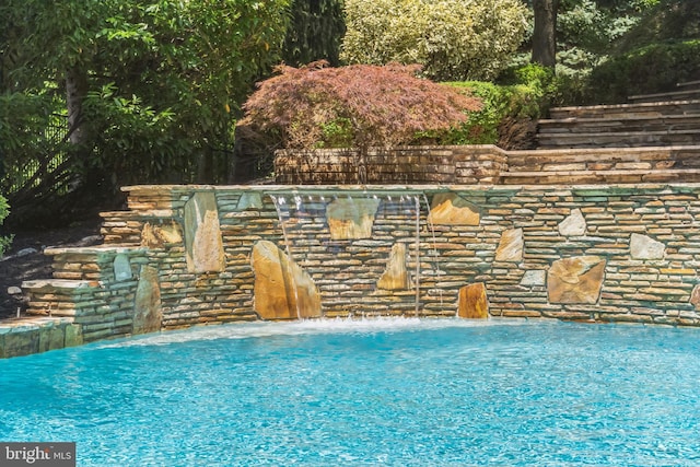 view of pool featuring pool water feature