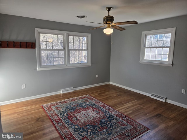 empty room with hardwood / wood-style flooring and ceiling fan