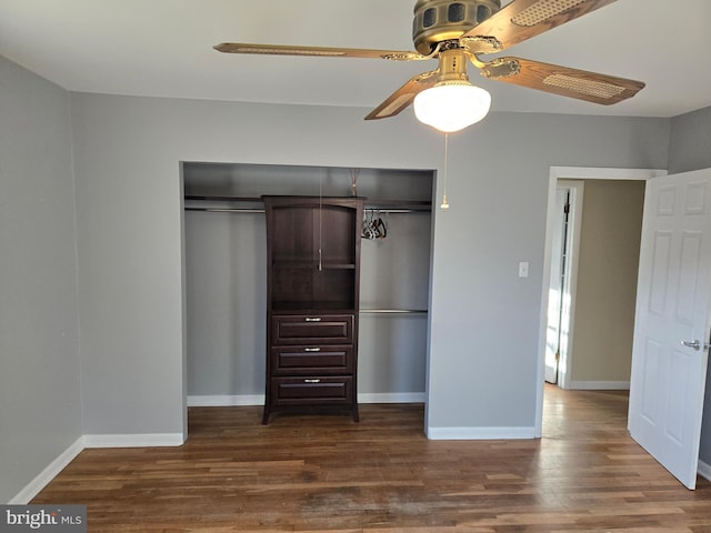 unfurnished bedroom with hardwood / wood-style floors, ceiling fan, and a closet