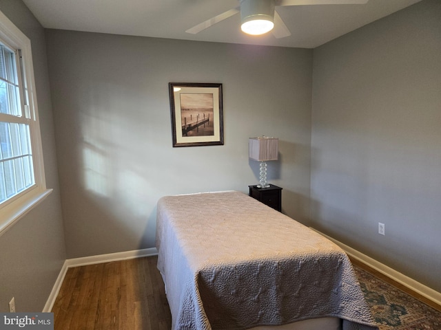 bedroom featuring ceiling fan and dark hardwood / wood-style floors