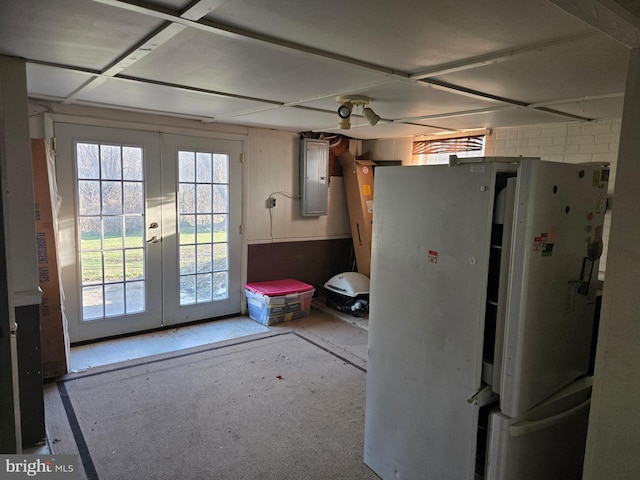 doorway to outside with electric panel and french doors