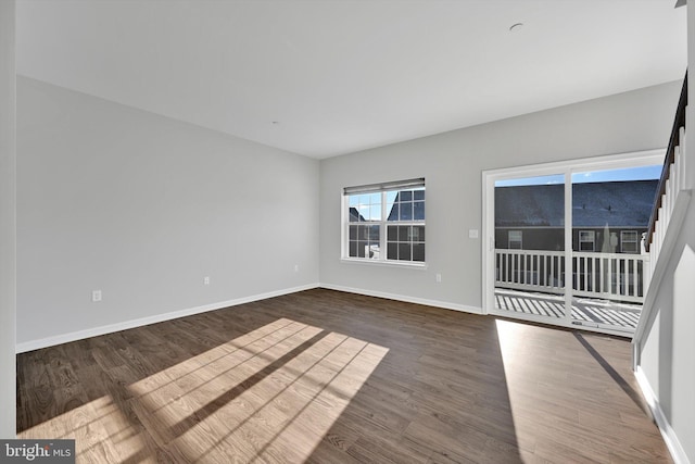 spare room featuring dark hardwood / wood-style floors