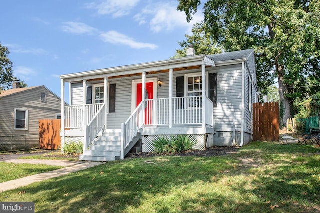 bungalow featuring a front yard and a porch